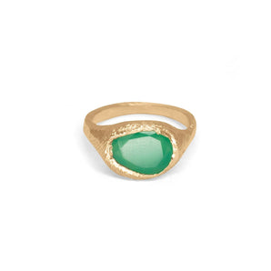 Gold ring with a green gemstone on a white background