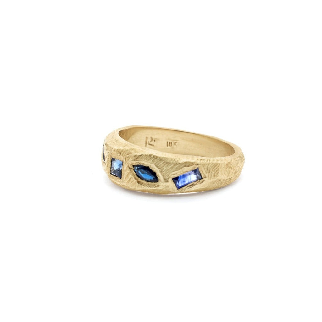 Handmade ring with five geometric blue sapphires in 18kt gold.