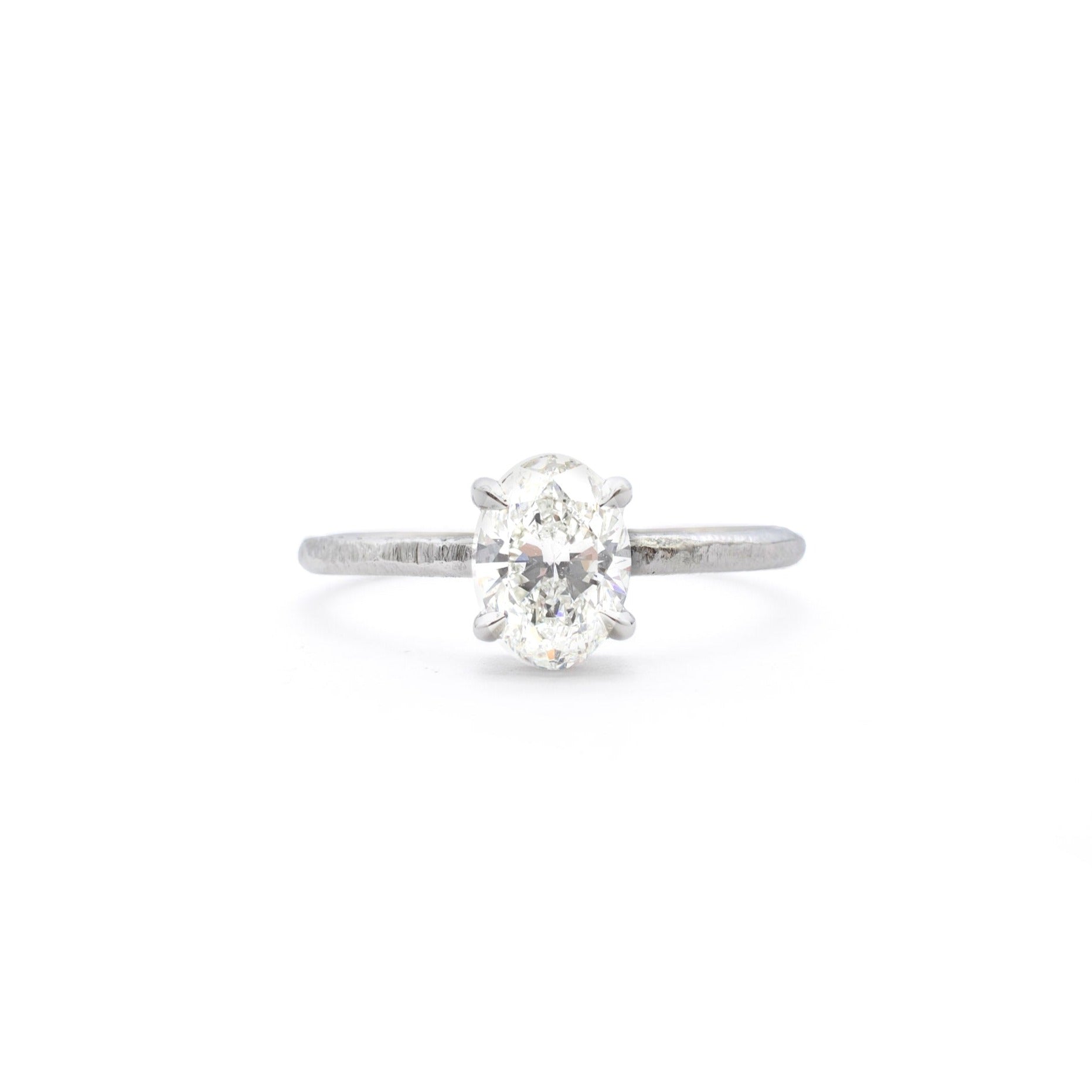 Handmade platinum engagement ring with oval diamond