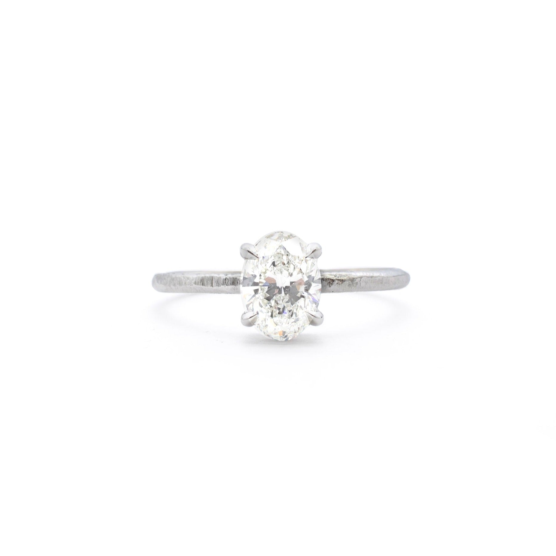 Handmade platinum engagement ring with oval diamond