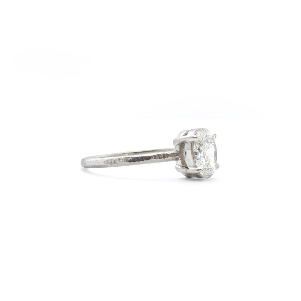 Handmade platinum engagement ring with oval diamond