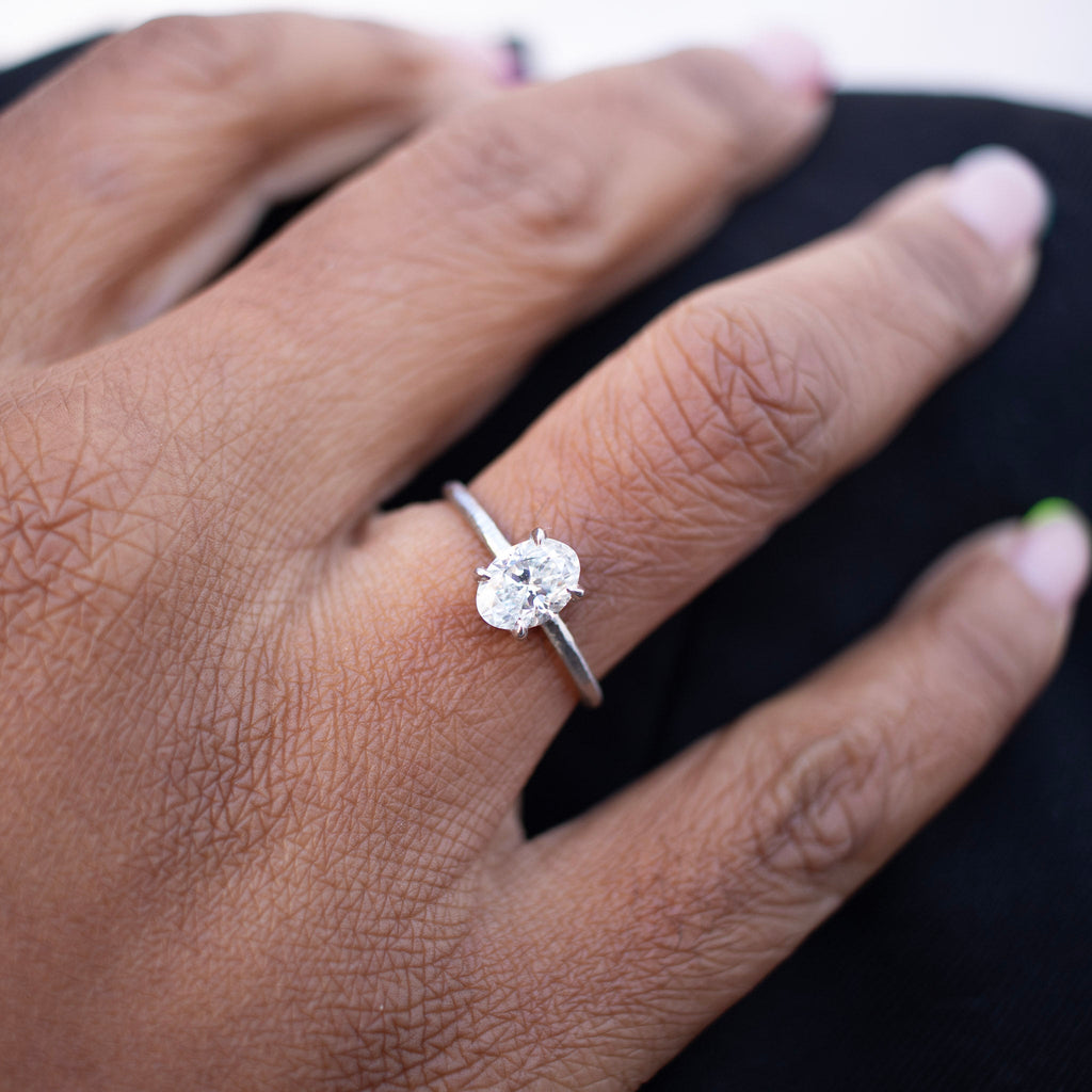 Handmade platinum engagement ring with oval diamond