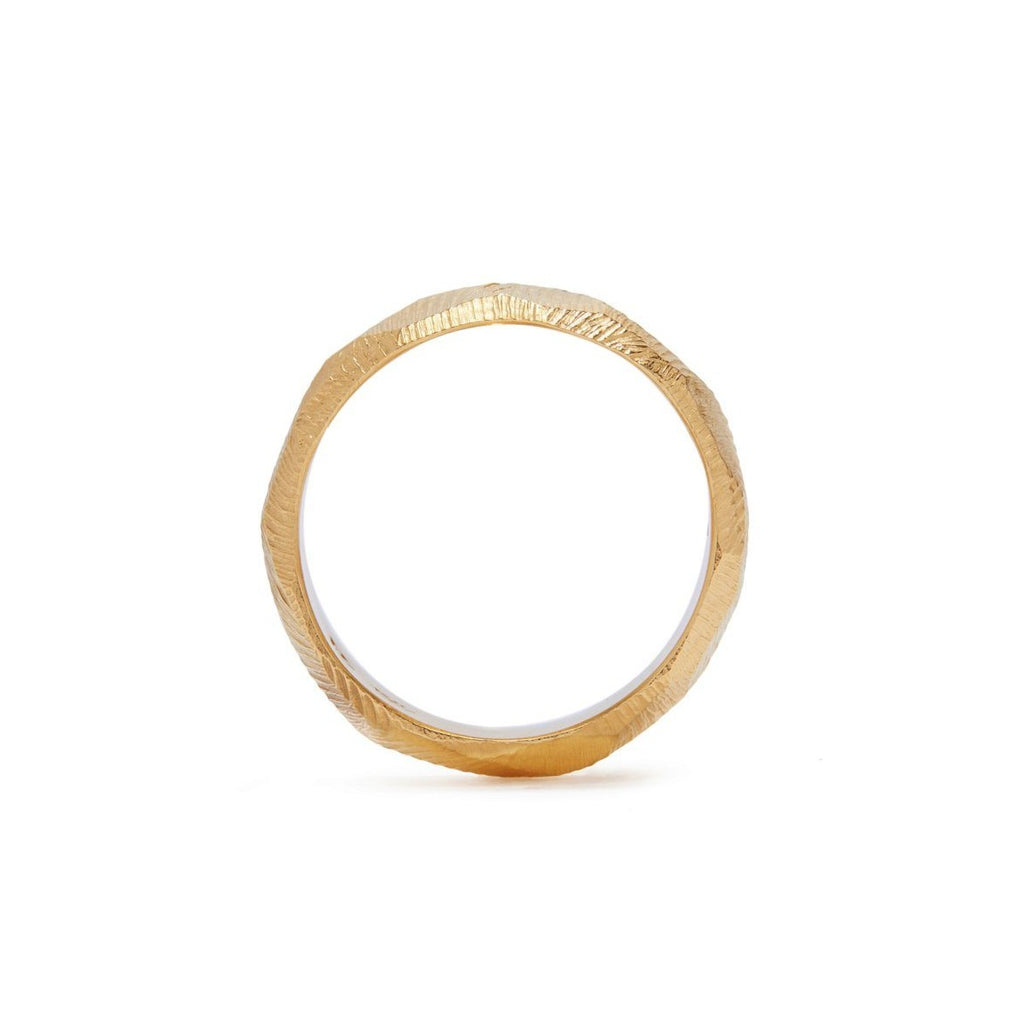 Handmade wedding band in 18kt gold with a 6mm width and hand carved texture.