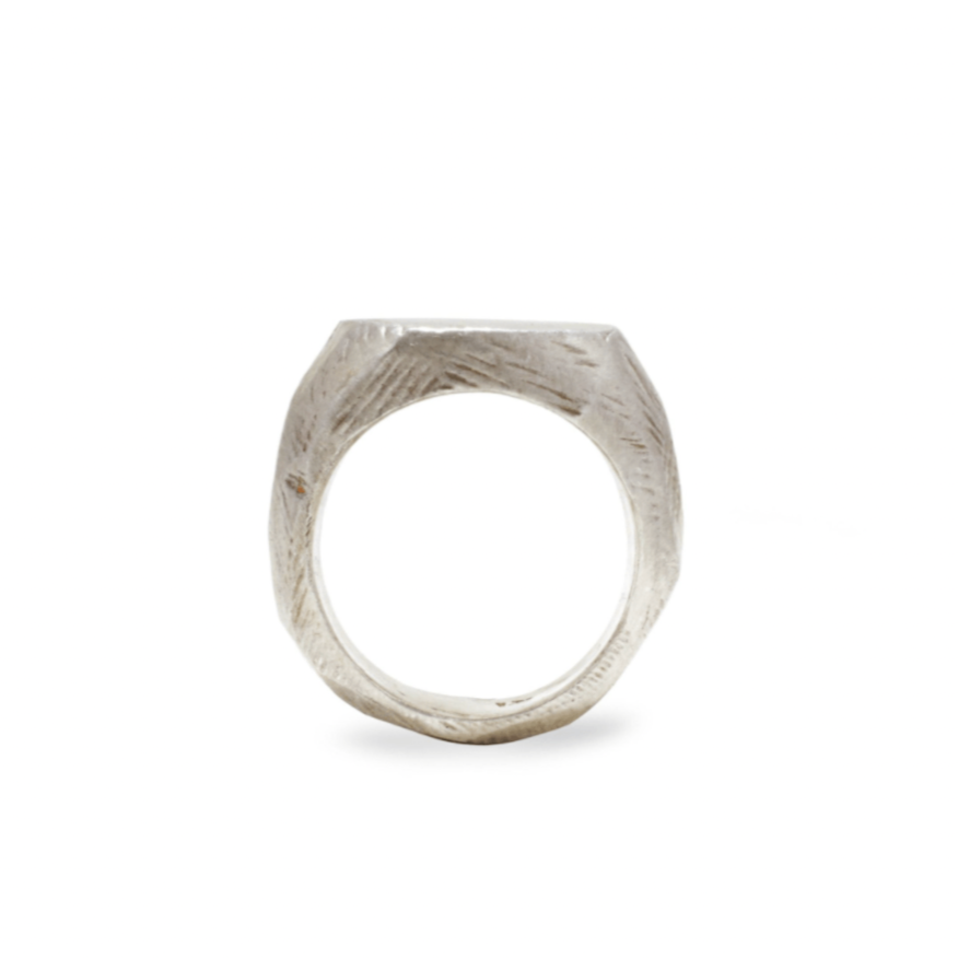 Handmade sterling silver signet ring with hand carved texture.