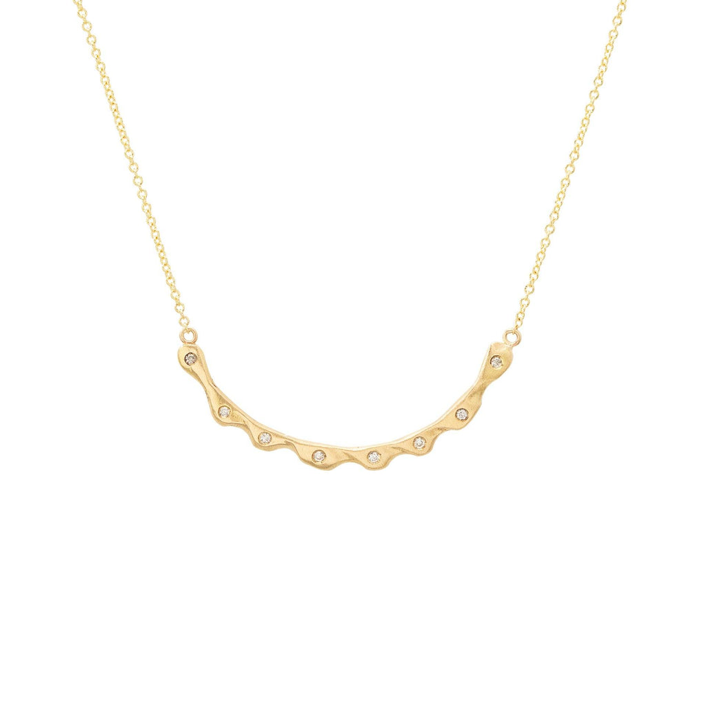 Handmade 18kt gold necklace with diamonds on a delicate chain.