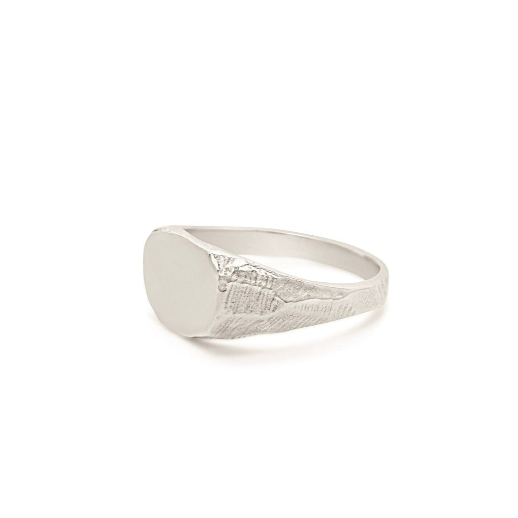 Handmade sterling silver signet ring with hand carved texture.